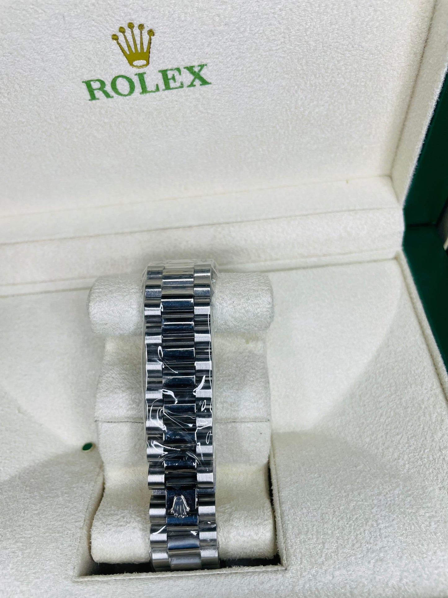 RLX white dial with silver chain strap